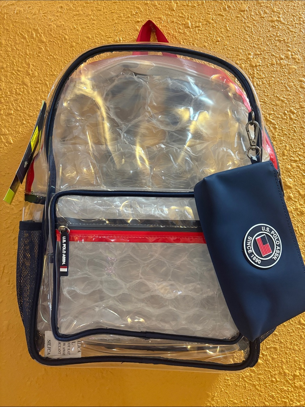 U.S. Polo Assn. Clear Backpack with Navy Trim and Red Accents